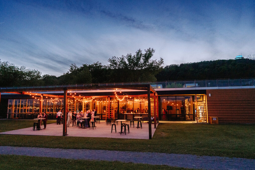 A beautiful nighttime view of a wedding venue, highlighting its exterior and the enchanting lighting that sets a romantic atmosphere for the celebration.