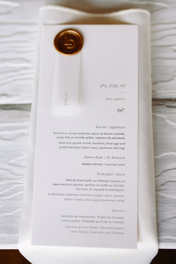 A beautifully designed wedding dinner food menu highlighting the appetizers, main courses, and desserts available for guests at a wedding reception.